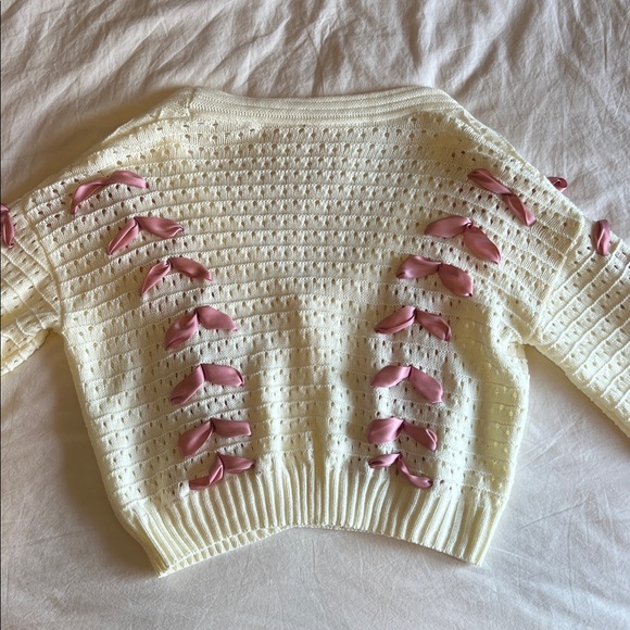 Elegant Cream Cardigan with Pink Ribbon Accents - Picture 2 of 9